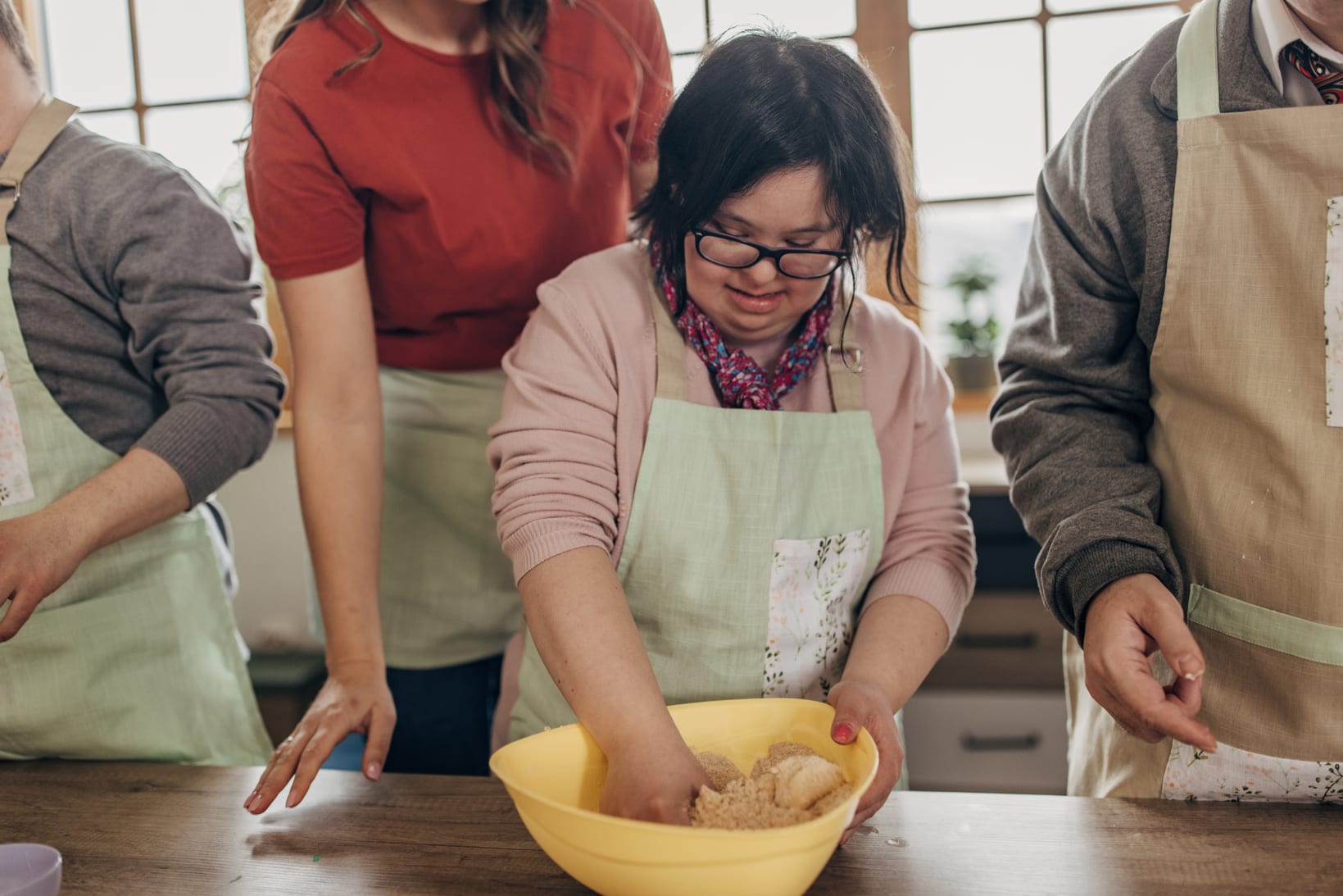 young person learning to cook