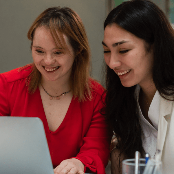two women working at a computer