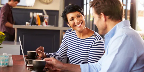 two people having coffee and a conversation